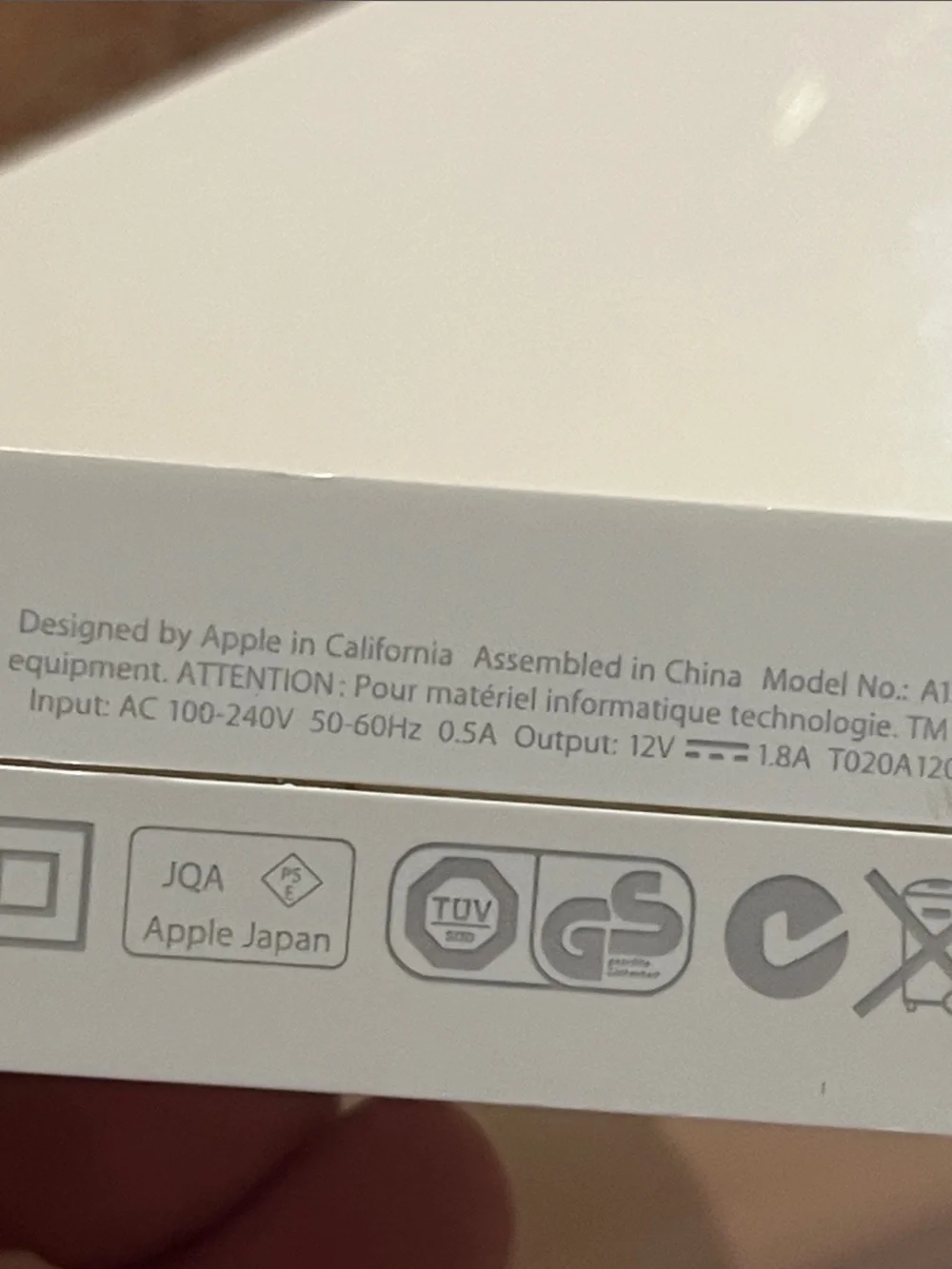 Apple AirPort Extreme base station with power supply.